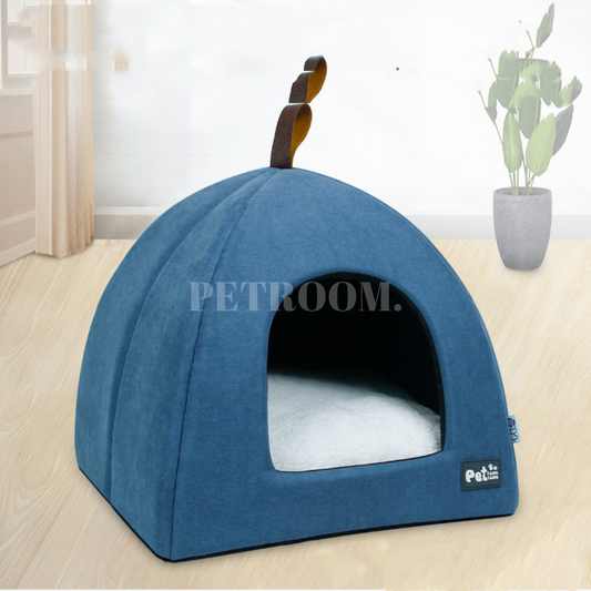 A blue cat bed kennel on a wooden floor
